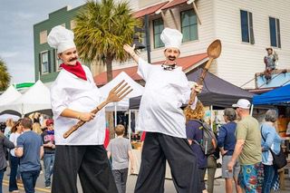 Taste of Folly costumed chefs on stilts provided